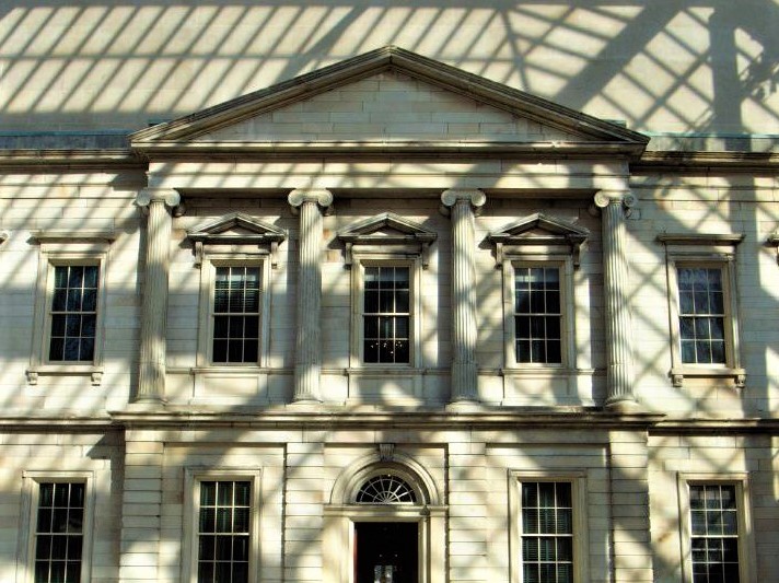 the facade of a marble greek temple