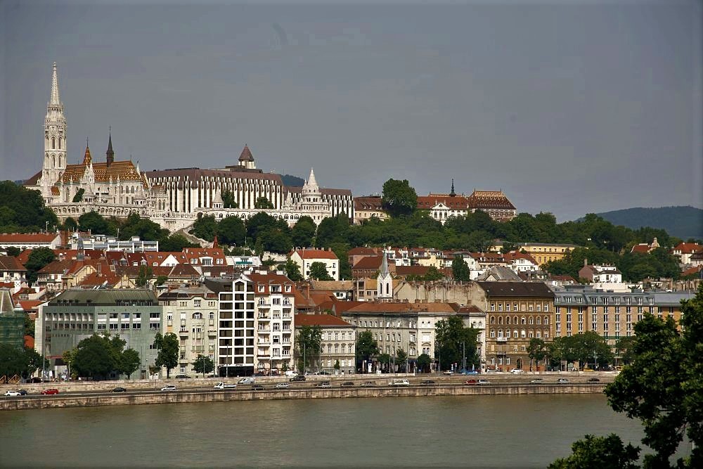 A view of the city of Budapest with the Danube River in the foreground
