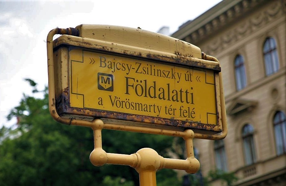 A yellow street sign