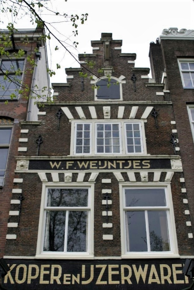 An ornate, narrow brick building