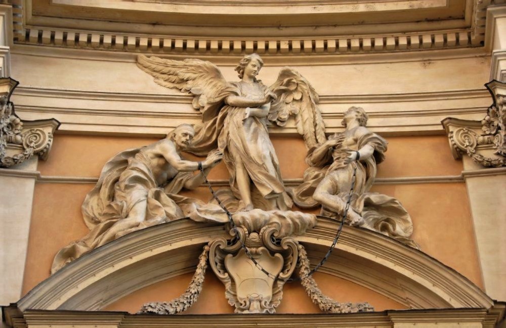 A Renaissance stone frieze featuring an angel and two humans