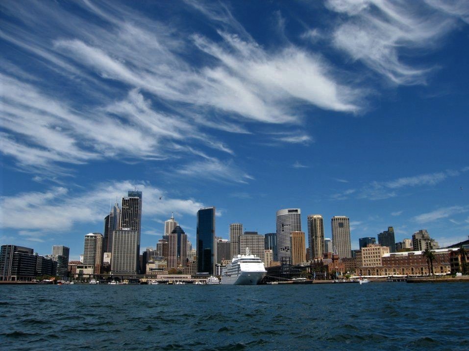 A wide shot of the city of Sydney viewed from the harbour