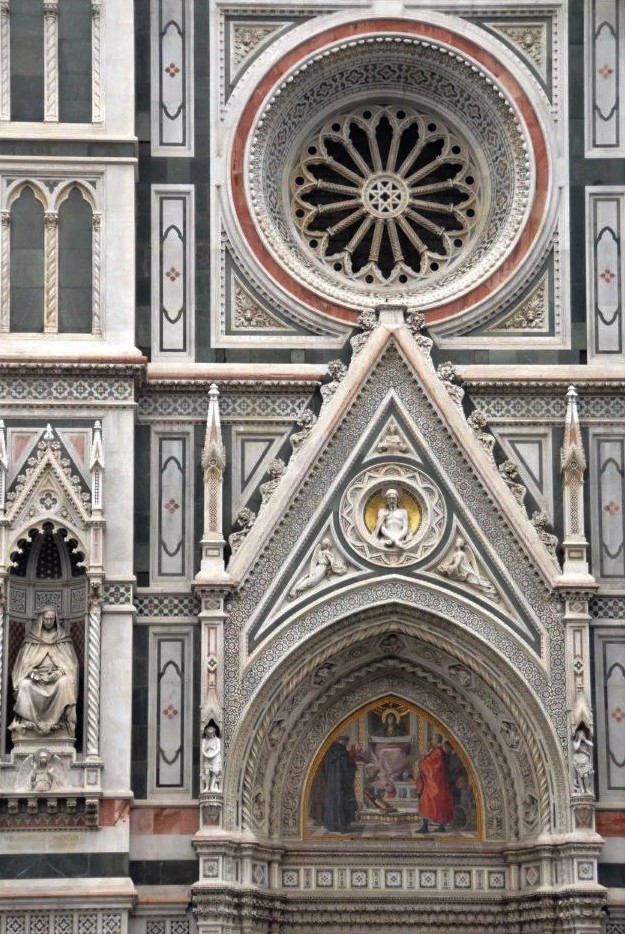 A close-up photo of the ornate base of the Duomo