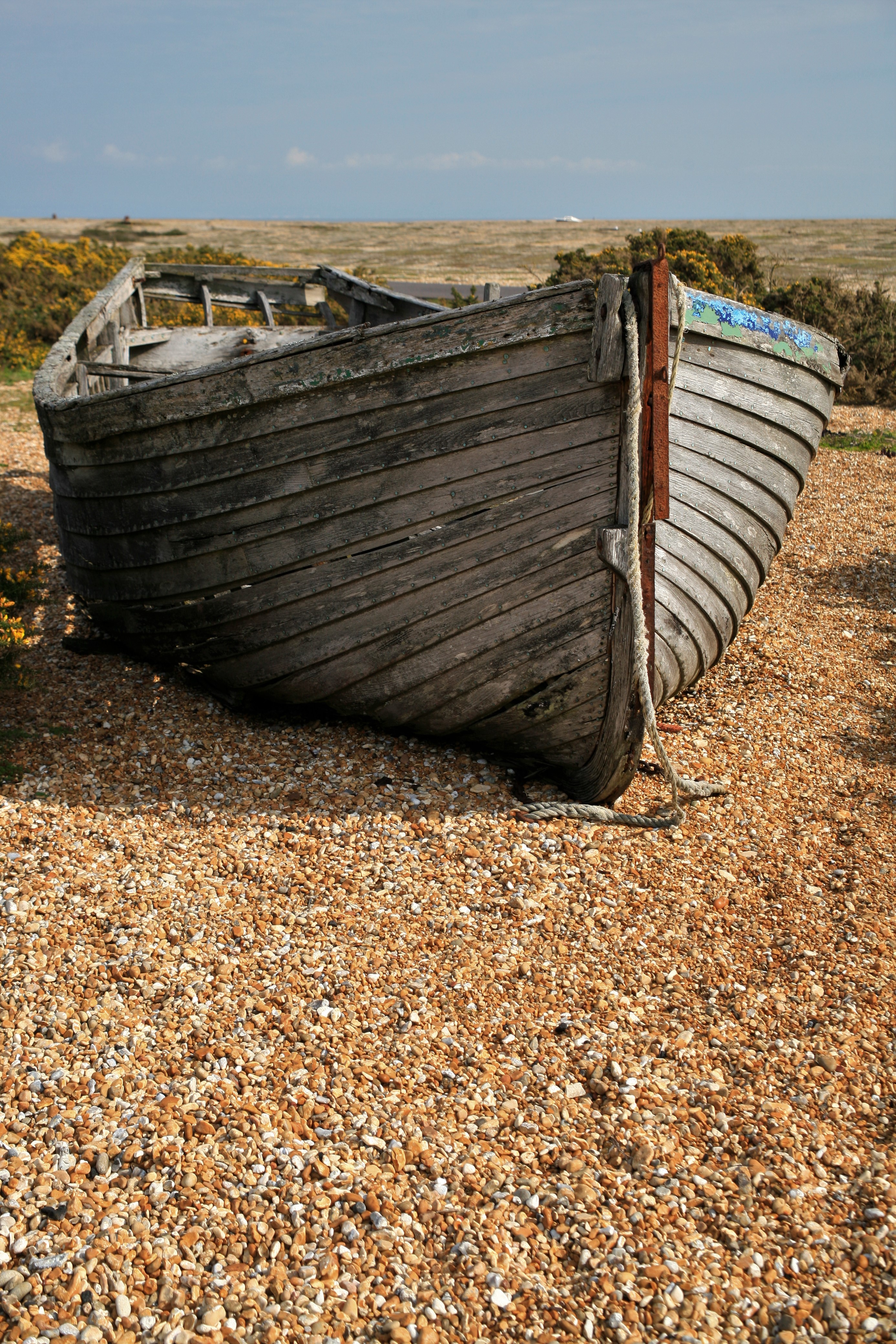 A weathered wooden boat viewed from the front