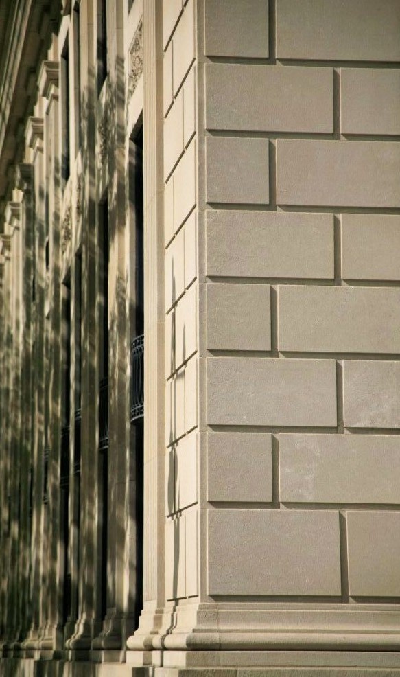 The corner of a sandstone building