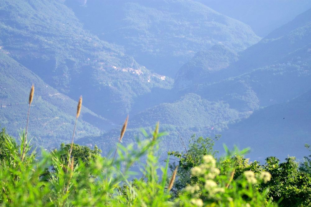 A hazy blue mountain in the Italian countryside