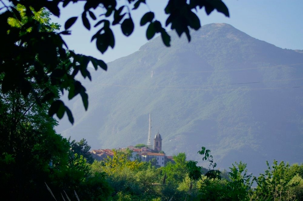 A hilltop villa viewed from a distance