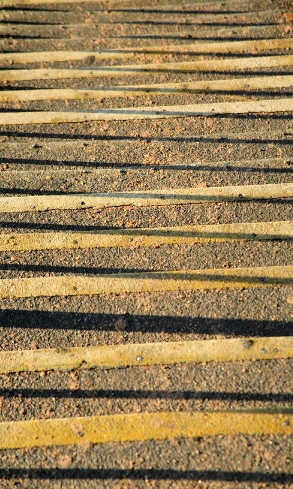 A stone staircase crossed with shadows