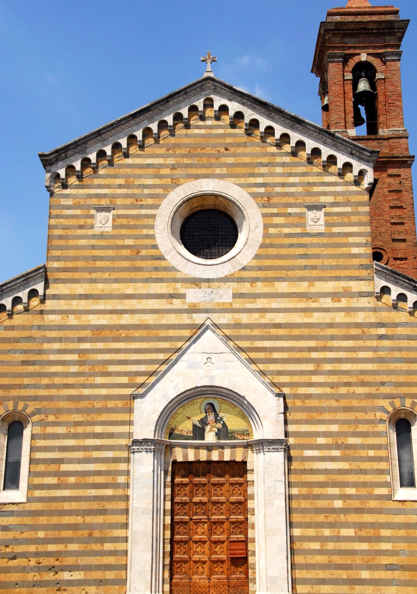 The front facade of a medieval sandstone church